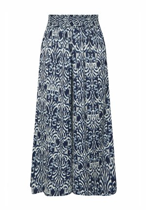 Laivastonsiniset leveälahkeiset housut, joissa on valkoiset monimutkaiset kukka- ja geometriset kuviot sekä smokattu vyötärönauha.