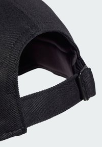 Black denim cap featuring a curved brim, adjustable strap at the back, and subtle stitching details on the fabric surface.