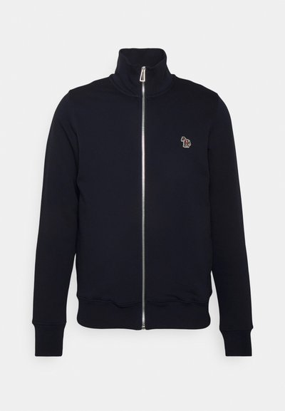 Sweat-shirt zippé bleu marine avec col montant, poignets et taille côtelés. Présente un logo brodé sur la poitrine gauche. Fabriqué en tissu doux.