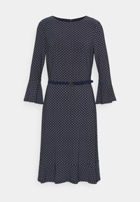 Marinblå klänning med långa trumpetärmar och en figursydd midja. Har ett cirkulärt mönster, rund halsringning och ett matchande bälte.