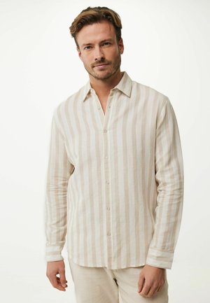 Camicia a righe beige chiaro in tessuto morbido, colletto, design con bottoni, maniche lunghe con polsini a bottone, righe verticali chiare e scure.