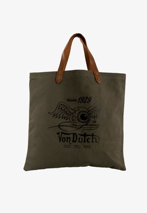 Bolsa tote de lona marrón con asas de cuero, con un logo de ojo alado y el texto "Since 1929 Von Dutch" en la parte delantera.