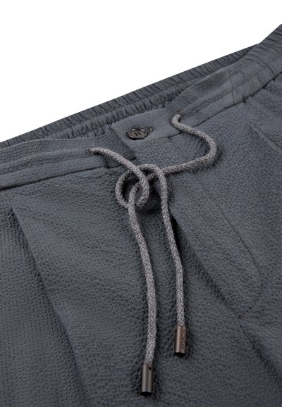 Dark gray shorts made from textured fabric, featuring an elastic waistband with a drawstring and a button closure at the front.