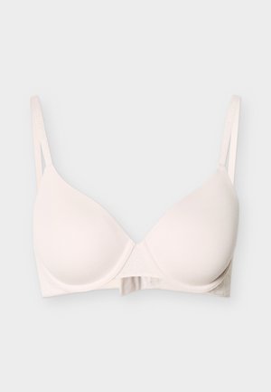 Ανοιχτό μπεζ επενδεδυμένο σουτιέν με ρυθμιζόμενους λεπτούς ιμάντες ώμων και ενίσχυση με μπανέλα, παρουσιασμένο σε απλό φόντο.