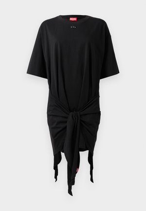 Juodas medvilninis t-marškinėlių suknelė su trumpomis rankovėmis, turinti mazgo detalę liemenyje ir logotipo žymę. Lygi tekstūra ir laisvas siluetas.