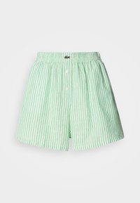 Zielono-białe szorty w paski, wykonane z lekkiego materiału. Posiadają elastyczny pasek w talii oraz dwa guziki z przodu.