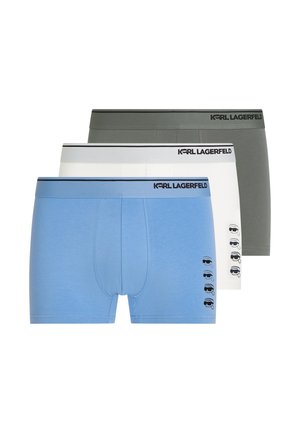 Drei Herren-Boxershorts in Blau, Weiß und Grau, jeweils mit Karl Lagerfeld-Logo am Bund und einem kleinen Gesichts-Graphic am Bein.