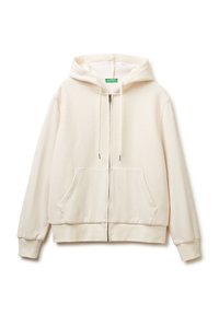 Sudadera color beige claro con textura de gofre, cierre frontal con cremallera, capucha con cordones y dos bolsillos frontales. Tejido suave con puños y dobladillo acanalados.