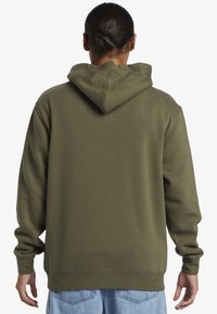 Olive green hoodie with a drawstring hood, ribbed cuffs, and waistband, made from soft cotton blend fabric, featuring a plain design.