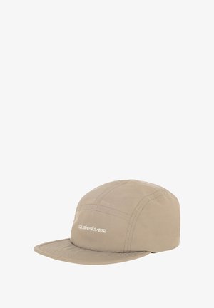 Beige cap with a flat brim, made of a smooth material. Features stitched panels and a white logo on the front.