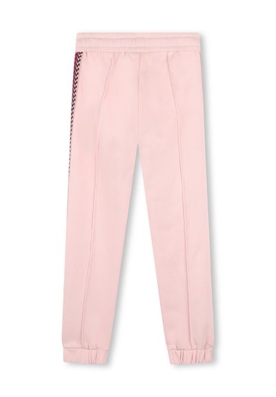 Pantalons de survêtement rose clair en tissu doux, dotés de détails en chevrons sur les côtés et de poignets élastiques aux chevilles.