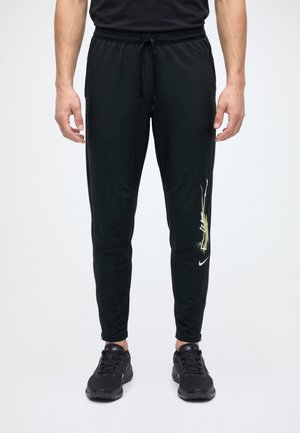 Nike Performance, STRIDE LET GO - Долнище на анцуг - black