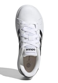 White tennis shoe with three black stripes, lace-up design, and padded tongue. Crafted from synthetic material with a textured finish.