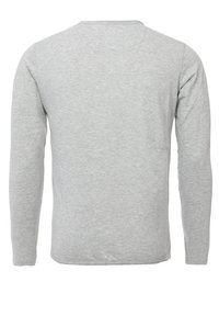 Langärmliges Hemd in Hellgrau, aus weichem Baumwollmischgewebe. Verfügt über einen Rundhalsausschnitt und eine lockere Passform. Keine sichtbaren Muster oder Akzente.