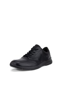Chaussure décontractée noire en cuir à lacets avec panneaux latéraux perforés et semelle coussinée, présentée sous un léger angle sur fond blanc.
