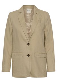 Blazer de lino beige con solapa muestrera, dos bolsillos frontales y dos botones marrones. Forro interior de satén suave. Ajuste a medida.