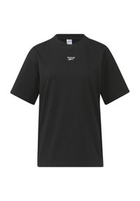 Svart bomullströja med rund hals, korta ärmar och en liten vit Reebok-logga på bröstet. Mjuk textur, avslappnad passform.