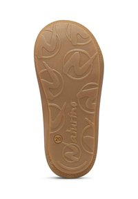 Semelle en caoutchouc plate de couleur beige avec une surface texturée ornée de motifs de logos circulaires et du nom de la marque. Taille indiquée comme 20.