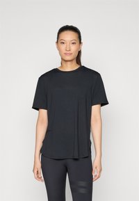 Black short-sleeve t-shirt with a round neckline and a relaxed fit, made of soft fabric. Smooth texture, subtle logo detail on the front.