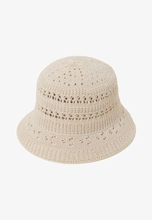 Beiger gehäkelter Eimerhut mit gemustertem offenen Strickdesign und leicht ausgestellter Krempe.