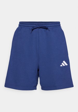 Navy blue cotton shorts with an elastic waistband and drawstring. Features white logo and side pockets. Soft texture and casual design.