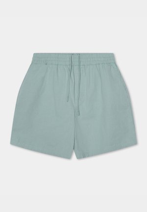 Lichtgroene shorts van zacht materiaal, met een elastische tailleband met een koord, zijzakken en een eenvoudig, glad ontwerp.