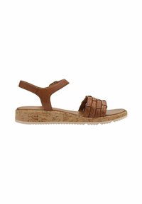 Brun lædersandal med kork-wedge sål, der har et krydsgående design på overdelen, justerbar ankelstrop og tekstureret ydersål.