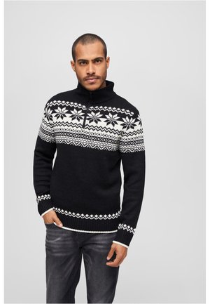 Schwarzer Strickpullover mit einem weißen geometrischen Muster auf der Brust, ausgestattet mit einem hohen Kragen und einem Reißverschluss. Gerippte Bündchen und Saum.