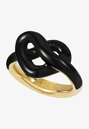 Zwarte abstracte ontwerp ring met zachte rondingen, voorzien van een gouden band en een gepolijste oppervlakte. Gegraveerd met "BREIL" op de binnenband.