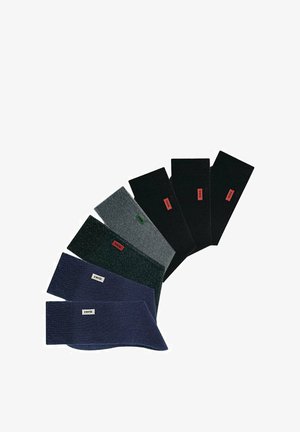 Set aus sieben elastischen, einfarbigen Stirnbändern in Schwarz, Dunkelgrau, Hellgrau, Marineblau und Dunkelgrün, mit Logo-Patches in kontrastierenden Farben.