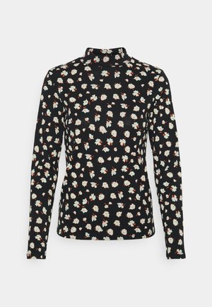 Haut noir à manches longues et col roulé avec un motif floral bleu clair et beige réparti uniformément sur le tissu.