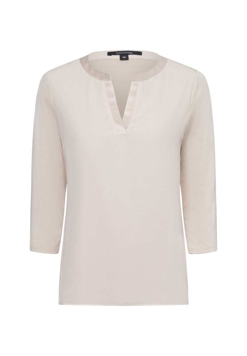 Helles beiges Langarmshirt mit Rundhalsausschnitt und einem kleinen V-Ausschnitt an der Vorderseite, aus einem glatten Stoff mit minimaler Struktur.