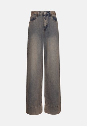 Wide-leg denim jeans in faded blue with a braided belt detail. Features five pockets and folded hem at the cuffs.