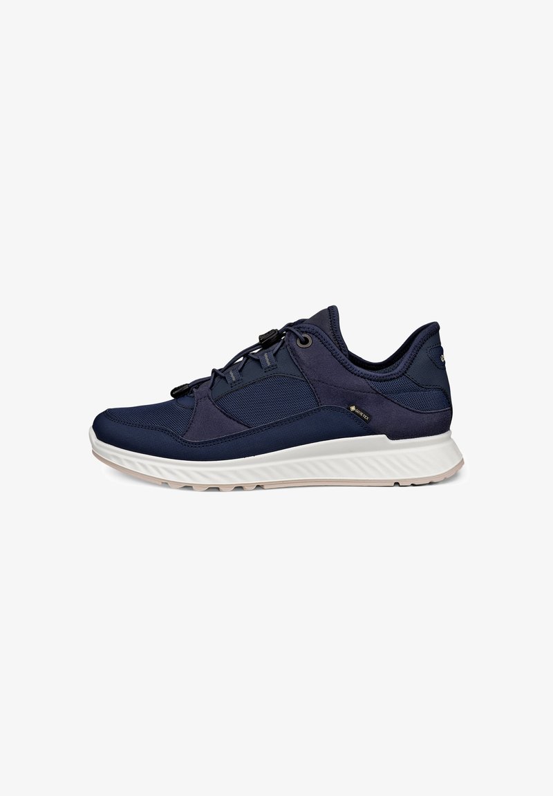 Dark blue athletic shoe with white sole, mesh and suede materials, and quick-pull lace system shown from the outer side.