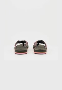 Flip-flops with a dark gray sole, pink and orange accent stripes, and patterned fabric straps. Textured surface on the sole.