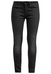 Jeans skinny negros de denim, con una textura suave, diseño de cinco bolsillos y cierre de botón con acentos metálicos.