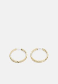 Boucles d'oreilles créoles en ton doré avec une finition lisse et texturée. Forme circulaire au design minimaliste. Équipées d'une fermeture à charnière pour un port sécurisé.