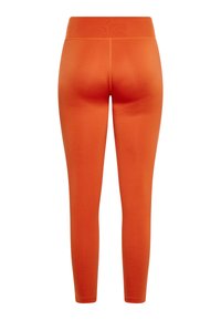 Oranje actieve leggings met een gladde textuur, een getailleerd ontwerp, een middelhoge tailleband en details van paneelstiksel. Geschikt voor trainingen.