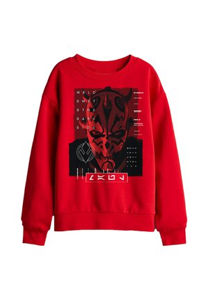 Red sweatshirt with graphic of a red and black horned face and text "Welcome to the dark side" in white and black design elements.