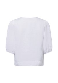 Weiße Bluse mit lockerer Passform, kurzen Puffärmel und rundem Ausschnitt. Hergestellt aus leichtem Stoff mit einer klaren, glatten Textur.