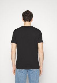 BOSS TEE CURVED - T-shirt basic - black