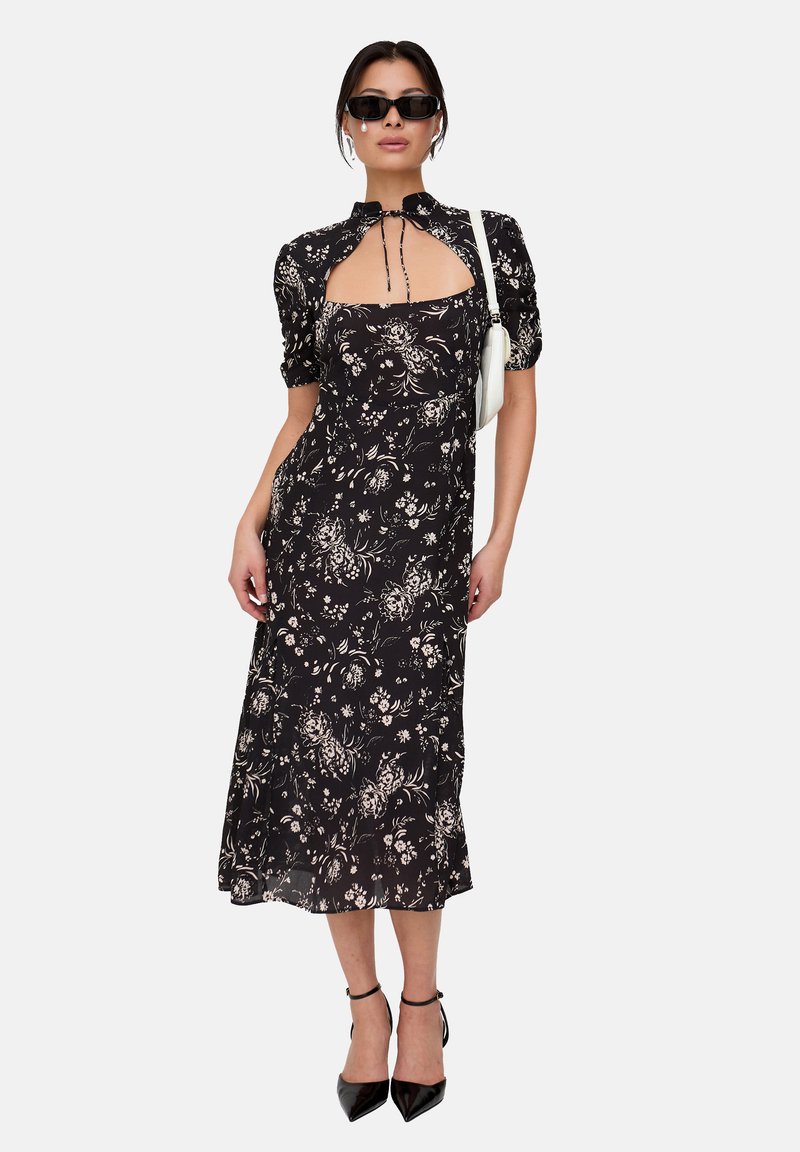 Black floral midi dress with puff sleeves, square neckline, and drawstring tie. Features a flowy silhouette and subtle white floral patterns.