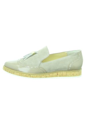 Light gray loafer with suede and patent leather, brogue detailing, tassel accent, and a cork texture sole.