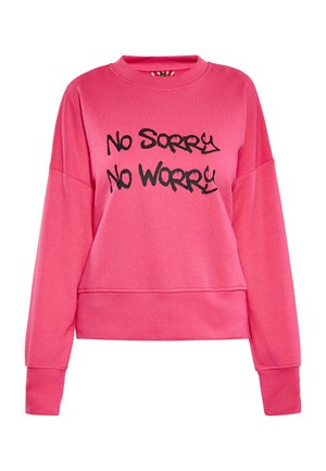 Růžový mikina s kulatým výstřihem a dlouhými rukávy, na přední straně s černým textem ve stylu graffiti "No Sorry No Worry". Měkký, ležérní design.