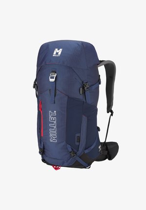 Sac à dos de randonnée Millet bleu foncé avec plusieurs sangles, poches latérales en mesh, bretelles et ceinture rembourrées, et une poche frontale zippée rouge.