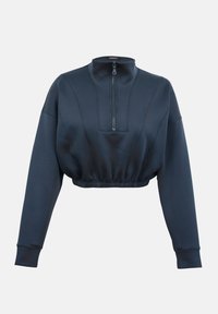Sweat-shirt court bleu marine avec manches longues, col montant, fermeture éclair devant et taille élastique sur fond uni.