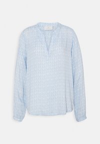 Blouse bleu clair à manches longues avec un col en V, présentant un motif géométrique de feuilles subtil et des poignets élastiqués. Tissu doux et léger.