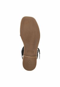Black sandal sole with a textured brown rubber bottom. Features include a logo and size marking (37), with a rounded heel and side cutouts.