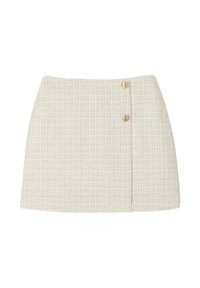 Jupe longueur genou en tweed texturé jaune clair et blanc, dotée de deux boutons dorés sur le côté pour la fermeture.