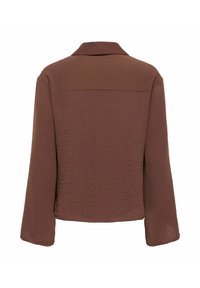 Veste courte marron texturée à manches longues avec col, présentée de dos sur un fond blanc.
